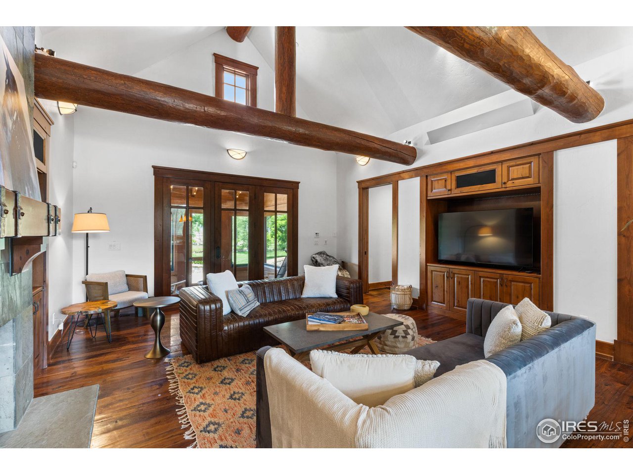 4651 Eldorado Springs Drive Boulder, CO 80303 - Photo 16 of 40 a living room with furniture and a flat screen tv