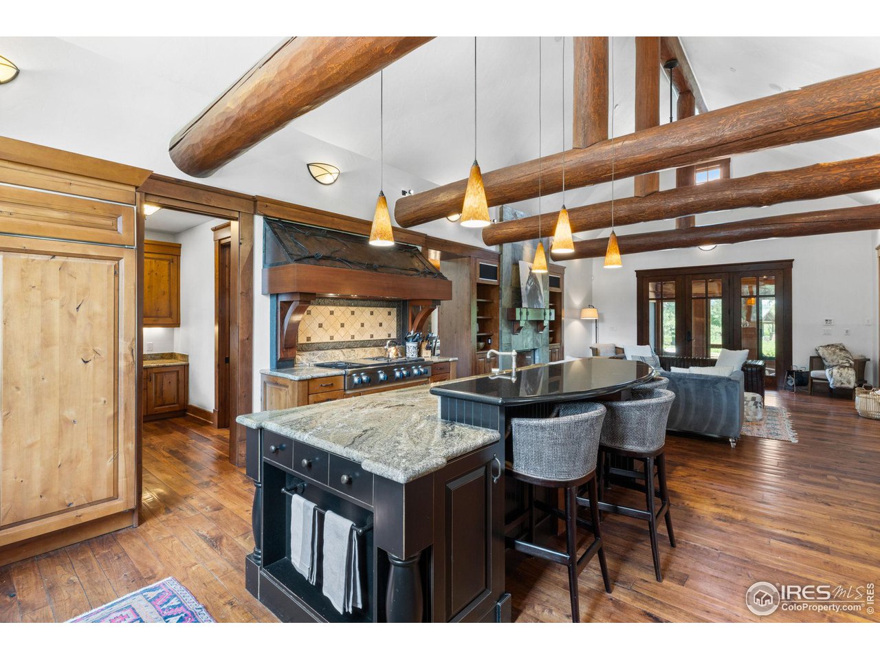 4651 Eldorado Springs Drive Boulder, CO 80303 - Photo 18 of 40 a dining hall with stainless steel appliances granite countertop wooden floor a dining table and chairs