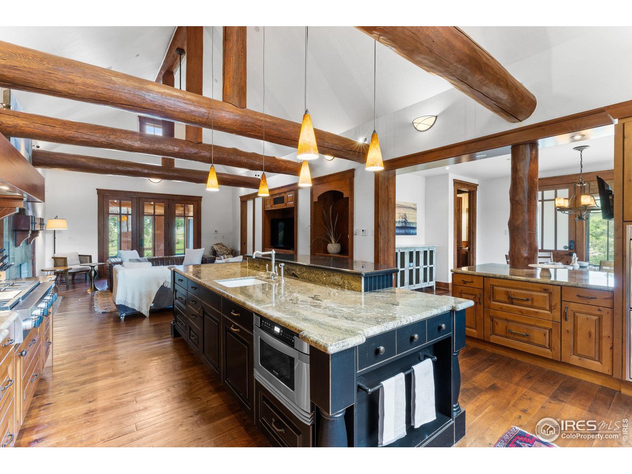 4651 Eldorado Springs Drive Boulder, CO 80303 - Photo 20 of 40 a kitchen with a stove and a kitchen island