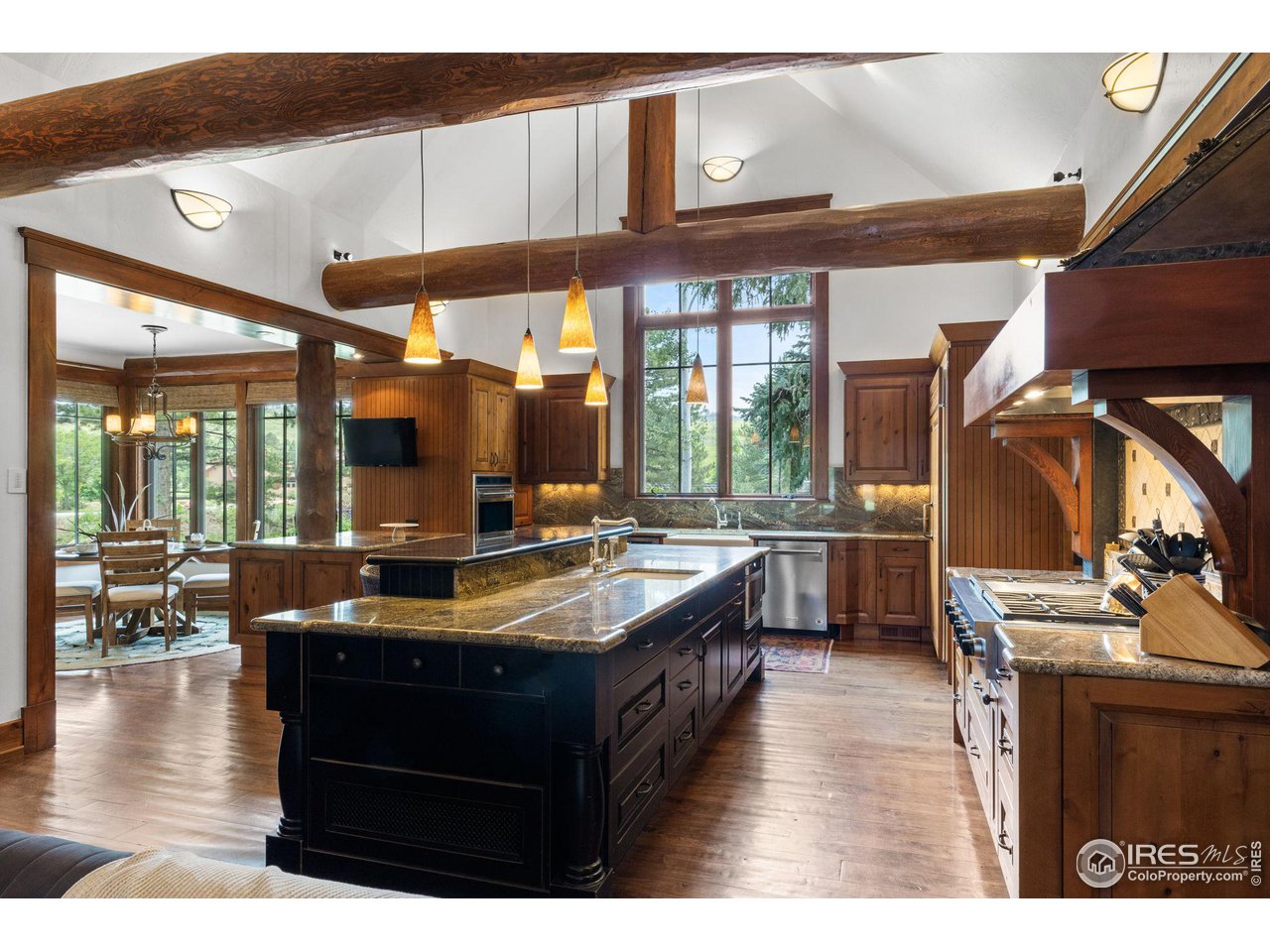 4651 Eldorado Springs Drive Boulder, CO 80303 - Photo 21 of 40 a kitchen with a stove a counter top space and a large window
