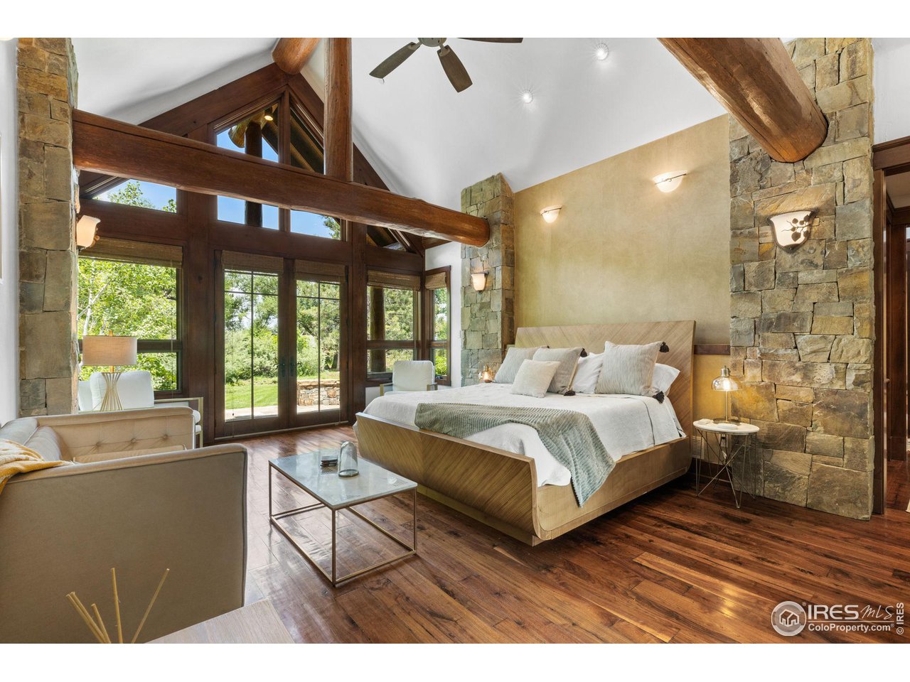 4651 Eldorado Springs Drive Boulder, CO 80303 - Photo 23 of 40 a living room with a bed furniture and a large window