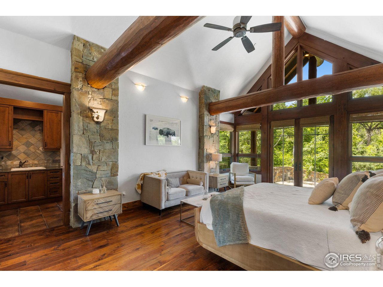 4651 Eldorado Springs Drive Boulder, CO 80303 - Photo 24 of 40 a living room with furniture a window and wooden floor