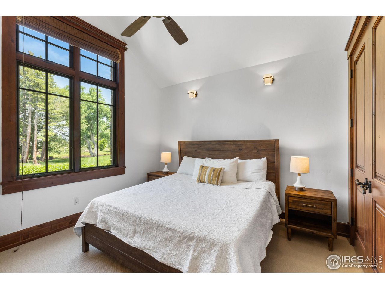 4651 Eldorado Springs Drive Boulder, CO 80303 - Photo 29 of 40 a bedroom with a bed next to a large window