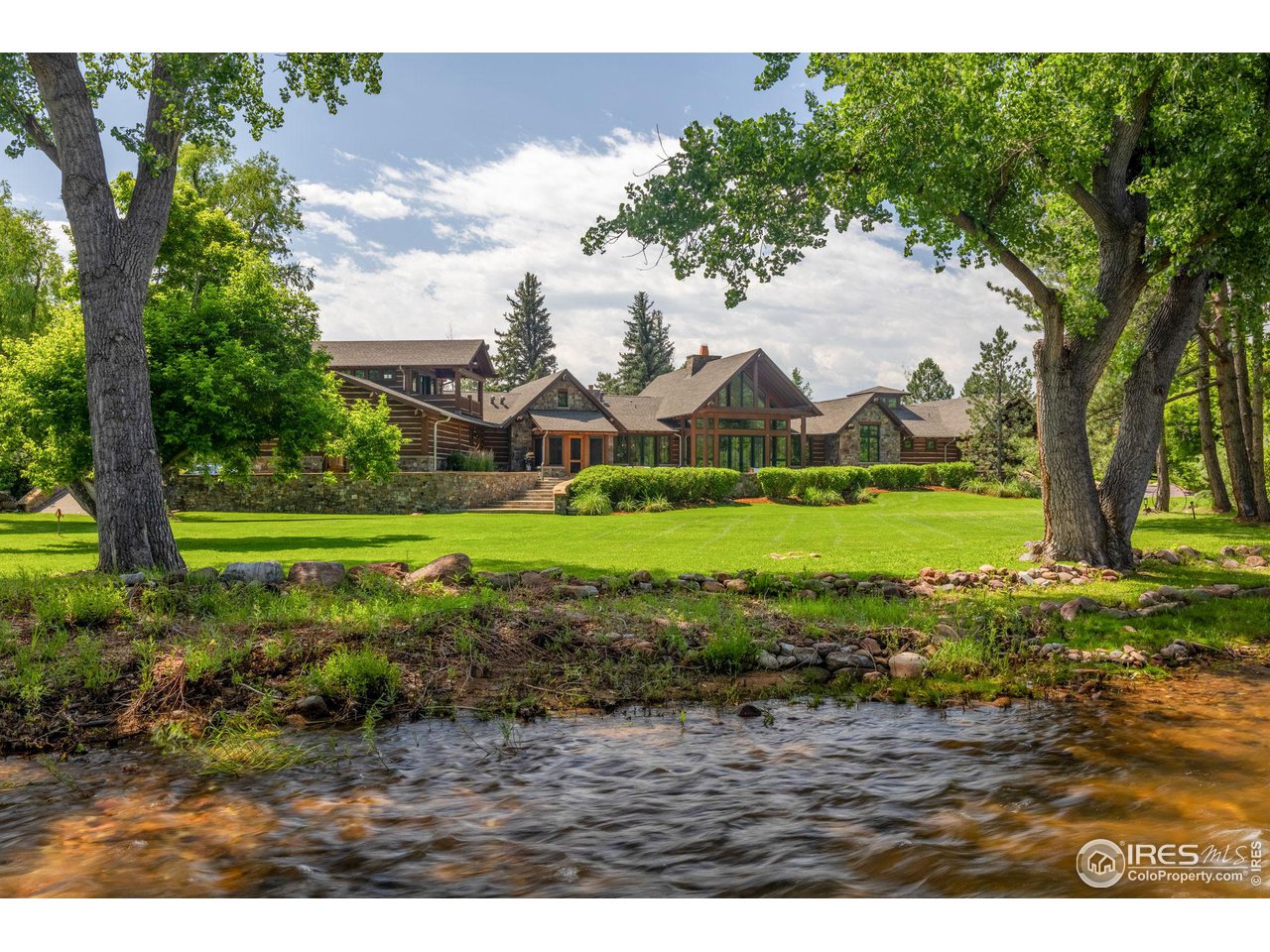4651 Eldorado Springs Drive Boulder, CO 80303 - Photo 3 of 40 a view of a garden with a house