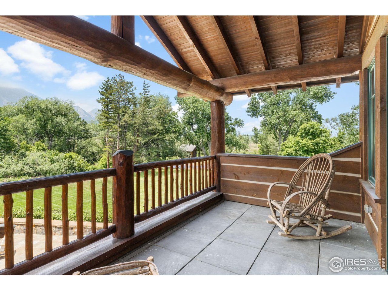 4651 Eldorado Springs Drive Boulder, CO 80303 - Photo 33 of 40 a view of a chair and table in the balcony