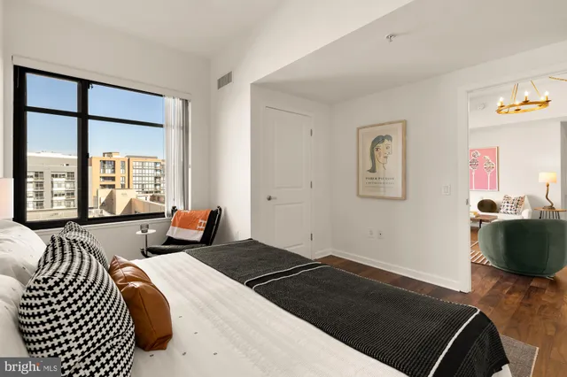 a bedroom with a bed and a view of bedroom