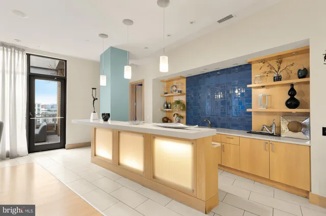 a living room with fireplace furniture and a table