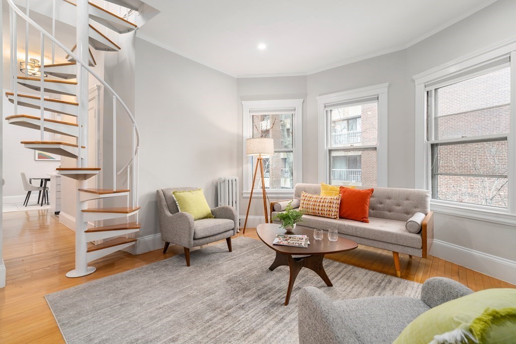 10 Remington Street, Unit 308 Cambridge, MA 02138 - Photo 1 of 21 a living room with furniture and a potted plant