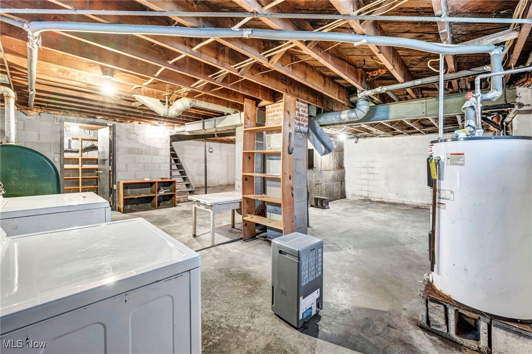 9982 Crow Road Litchfield, OH 44253 - Photo 27 of 41 Basement featuring washer and clothes dryer and gas water heater