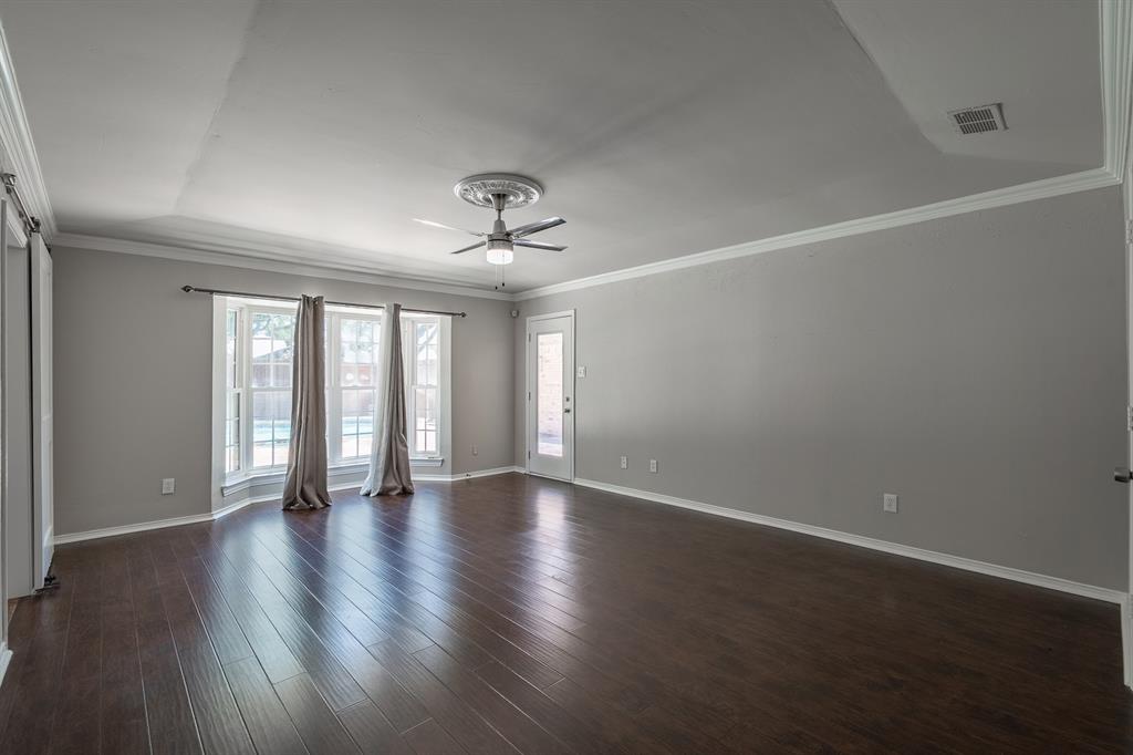 3316 Appalachian Way Plano, TX 75075 - Photo 14 of 29 a view of an empty room with a window and wooden floor