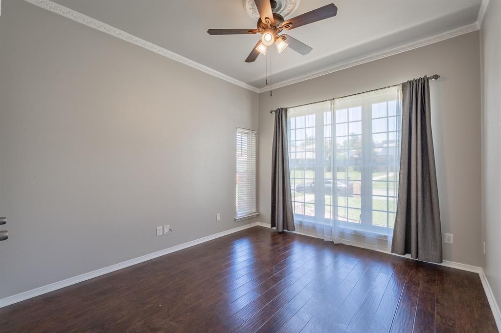 3316 Appalachian Way Plano, TX 75075 - Photo 18 of 29 a view of an empty room with wooden floor and a window