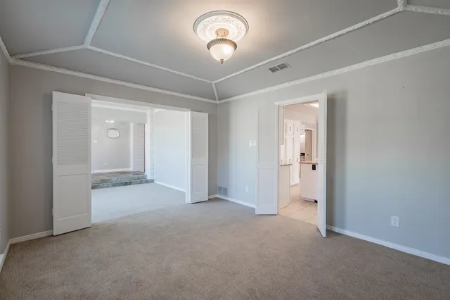 a view of a chandelier fan and entryway
