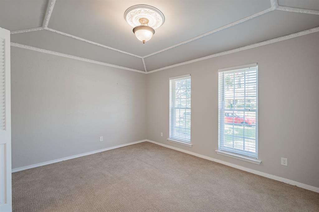 3316 Appalachian Way Plano, TX 75075 - Photo 5 of 29 en empty room with windows and chandelier fan