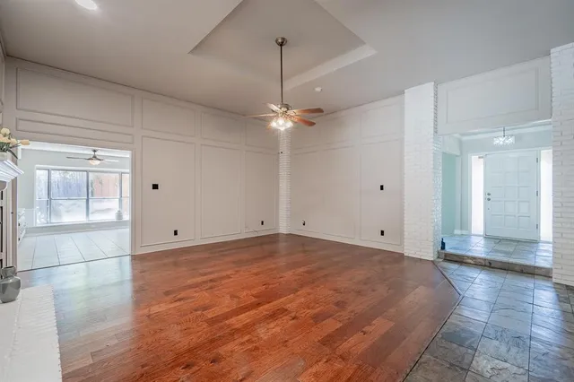 a view of a room with a sink and a mirror