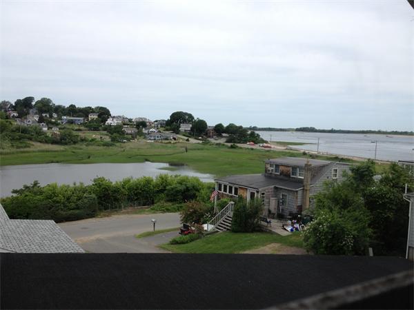 10 Cove Road Ipswich, MA 01938 - Photo 6 of 9 a view of a lake with a big yard