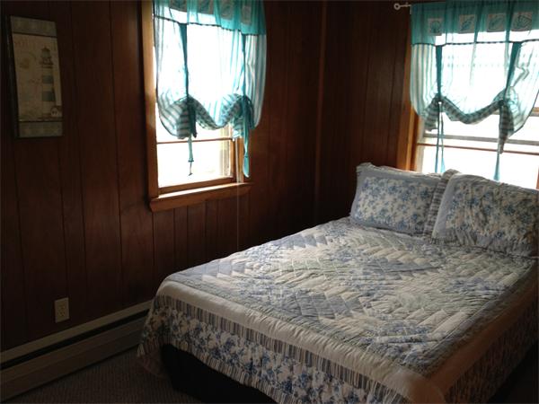 10 Cove Road Ipswich, MA 01938 - Photo 7 of 9 a bedroom with a bed and window