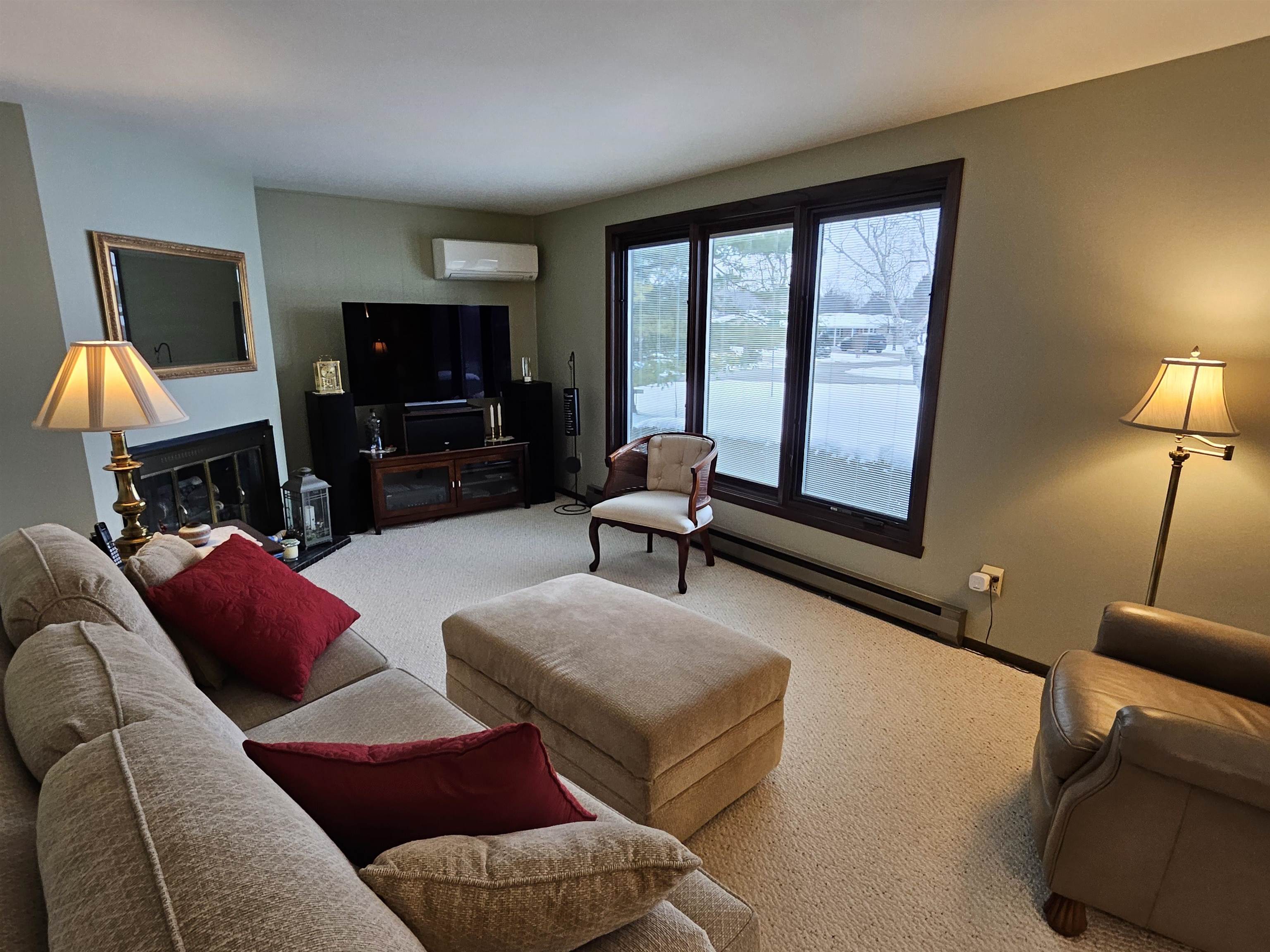 2155 Oriole Drive Freeport, IL 61032 - Photo 4 of 20 a living room with furniture a flat screen tv and a large window