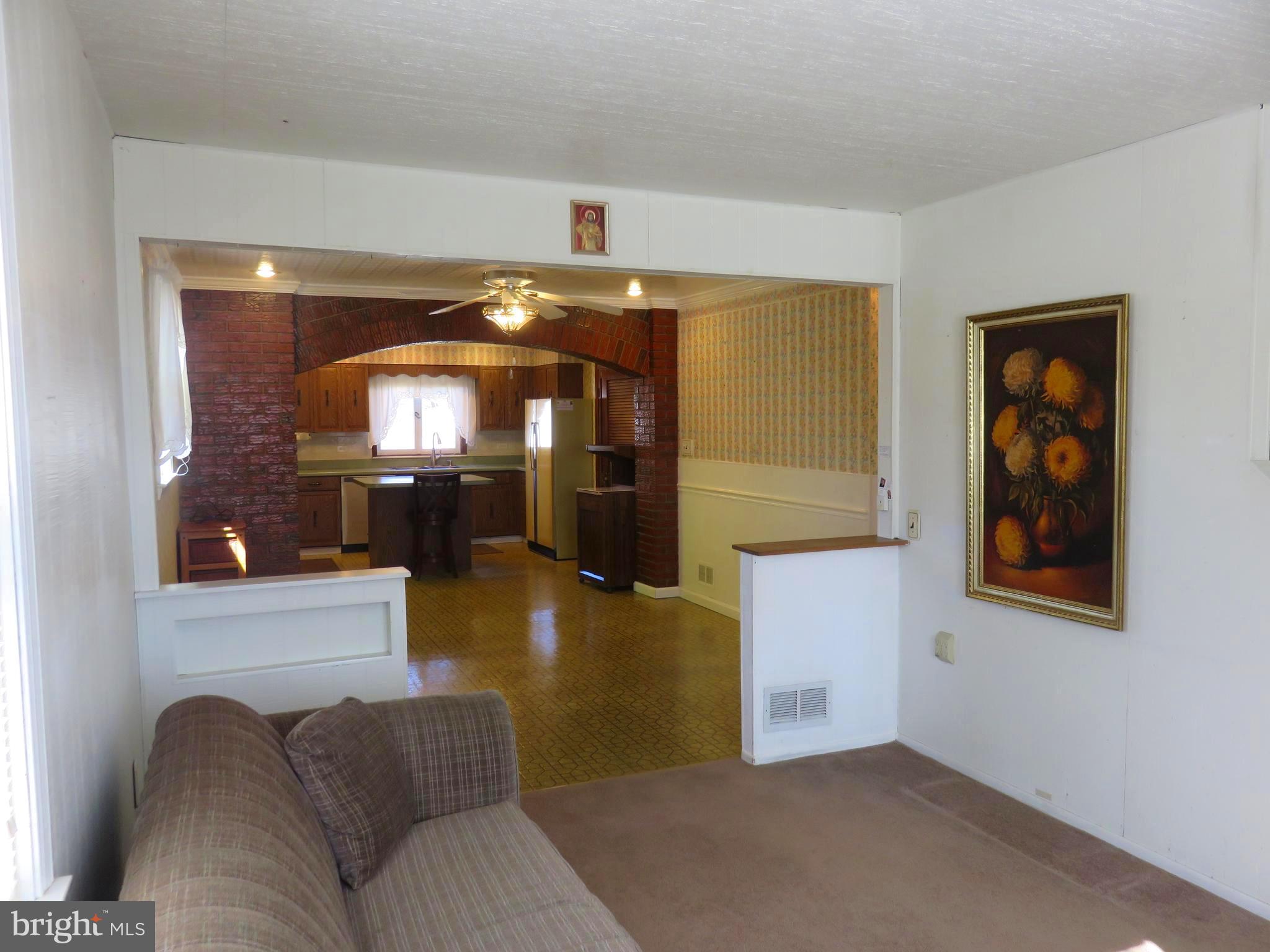 1710 Orlando Road Baltimore, MD 21234 - Photo 32 of 32 a living room with furniture and a chandelier