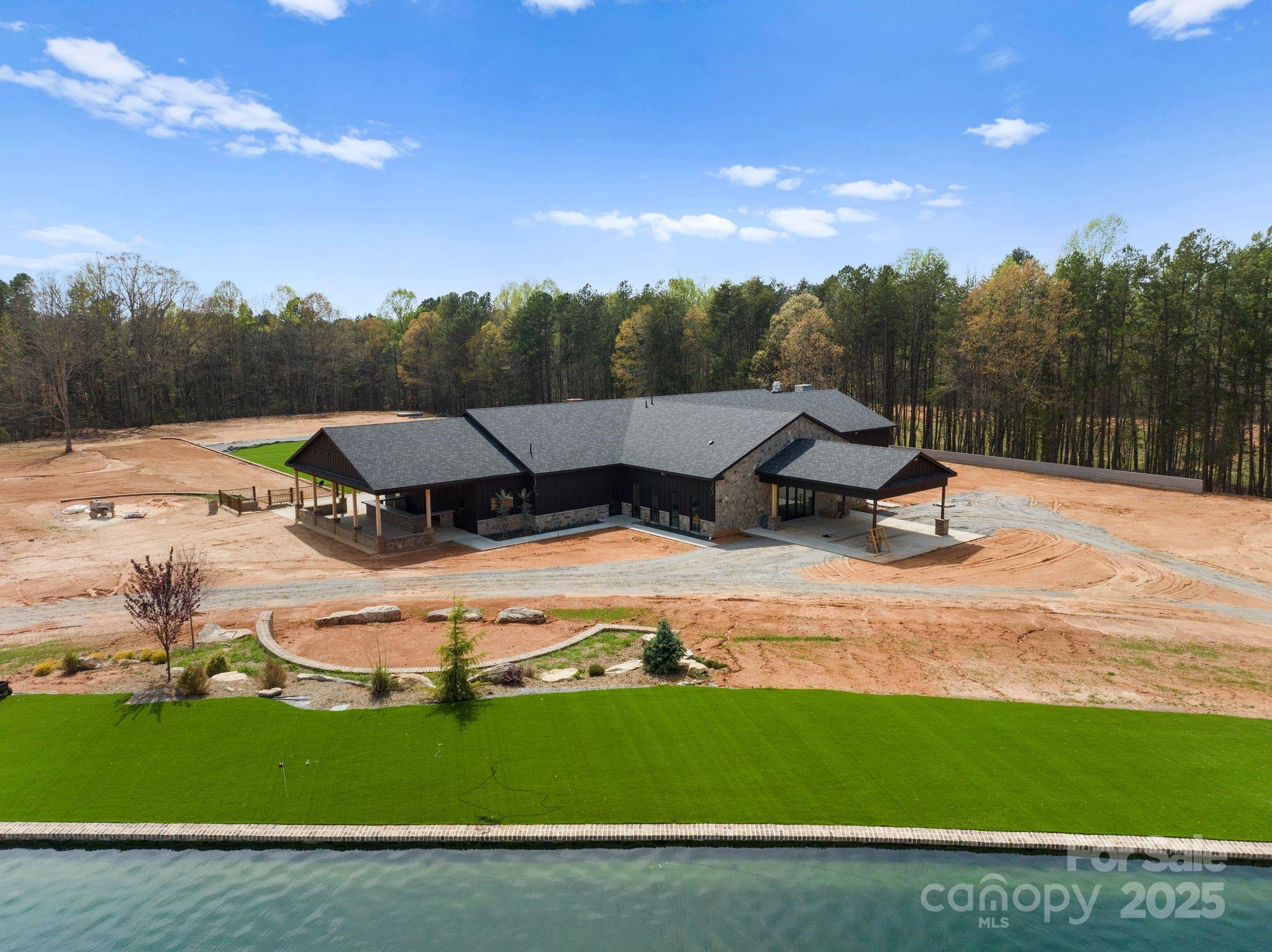1565 Shinnville Road Cleveland, NC 27013 - Photo 1 of 47 a view of a lake with a big yard