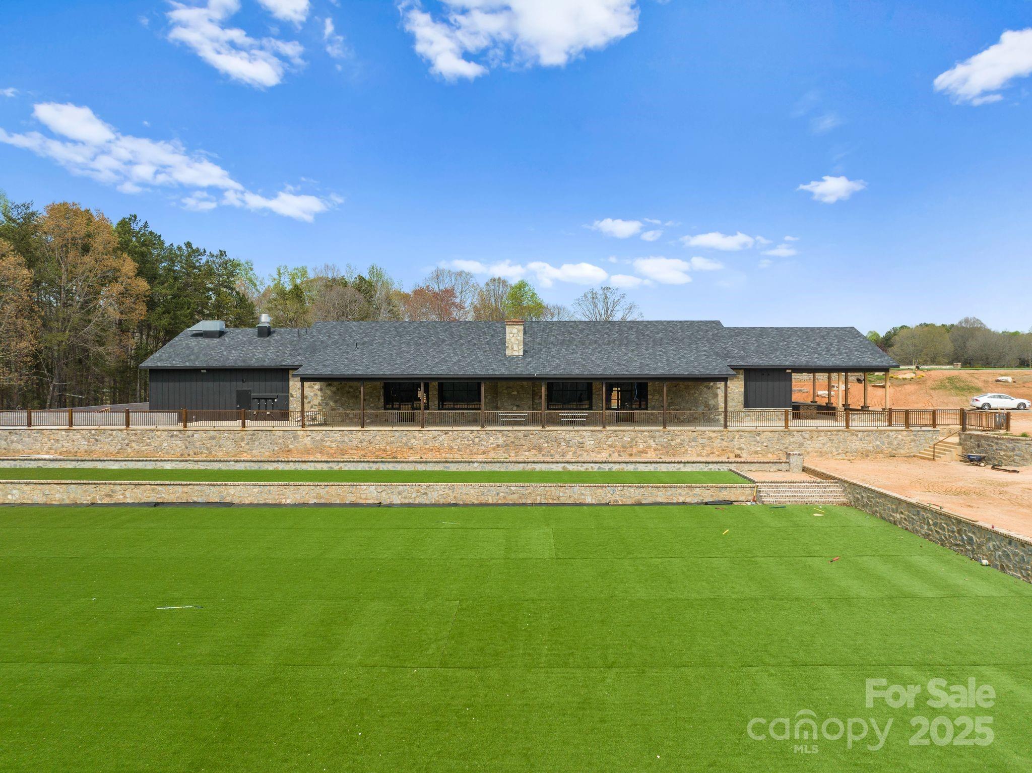 1565 Shinnville Road Cleveland, NC 27013 - Photo 15 of 47 a front view of a house with a garden
