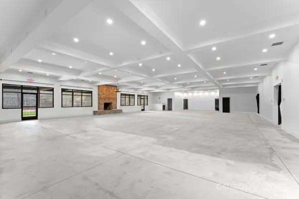 a view of a big room with windows