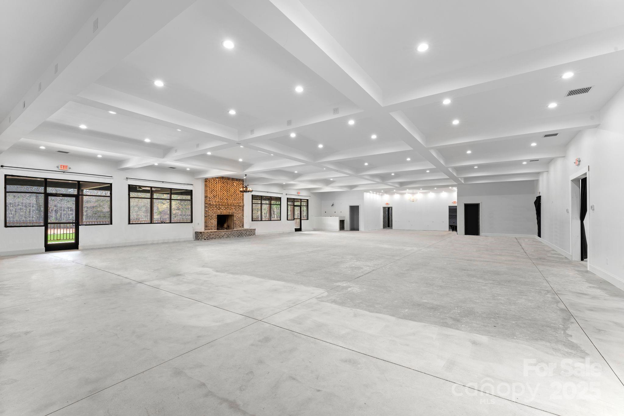 1565 Shinnville Road Cleveland, NC 27013 - Photo 3 of 47 a view of a big room with windows