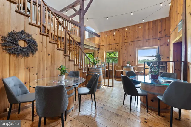 a room with lots of furniture and white walls