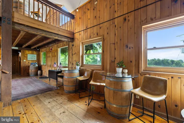 a view of entryway with wooden floor and stairs