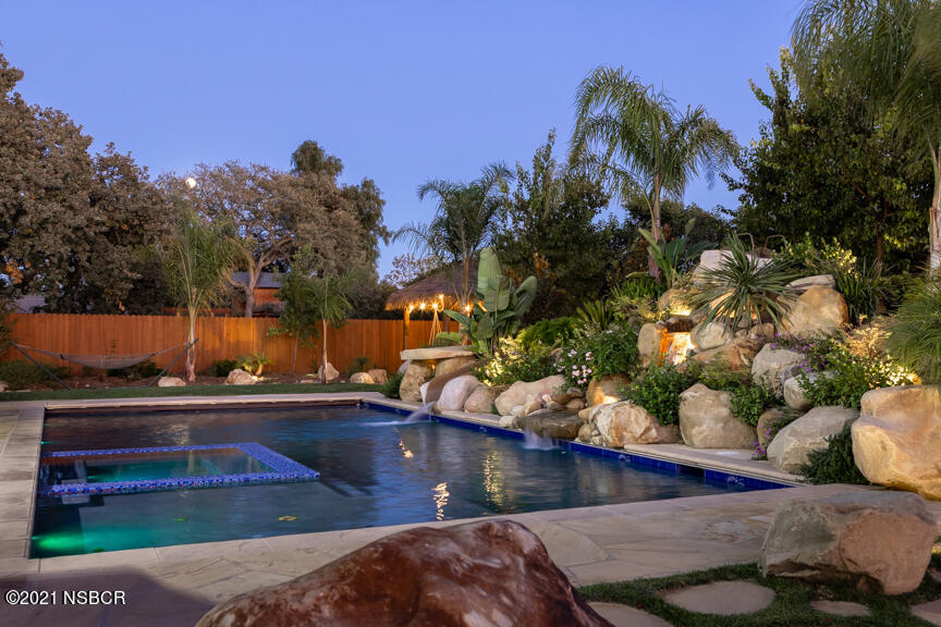 Oversized Pool with Slide and Fountain.