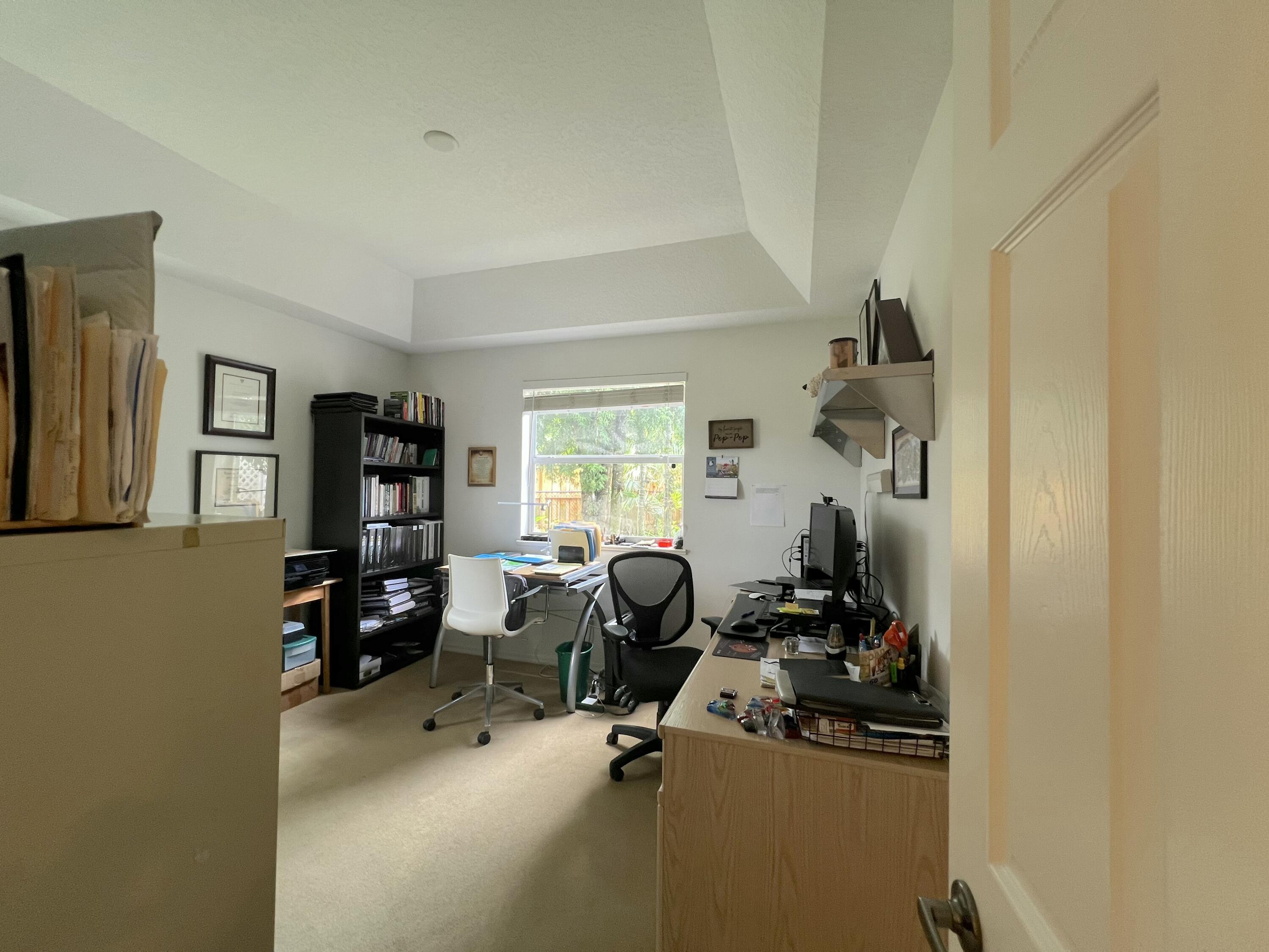 4292 Southeast Rainbows End Stuart, FL 34997 - Photo 30 of 53 a view of a workspace with furniture and a window