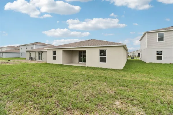 a view of a backyard of the house