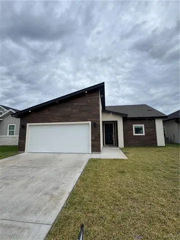 a front view of house with yard