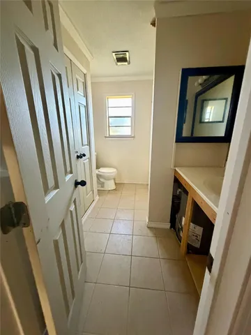 a bathroom with a toilet and a bathtub