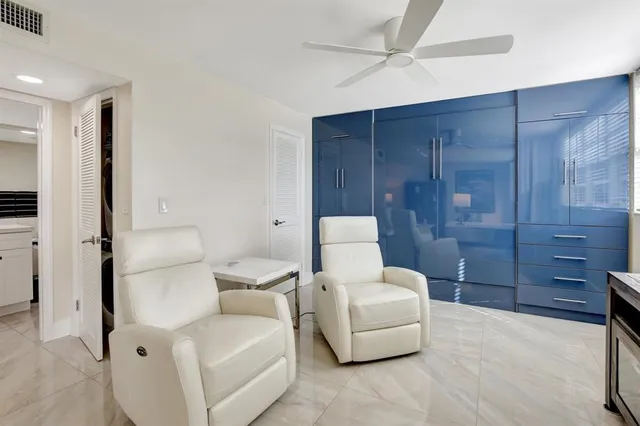 a living room with furniture and a shower