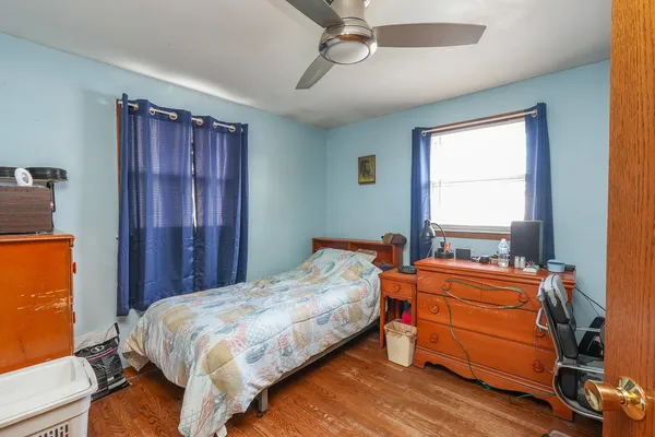 a bed room with a bed and a window