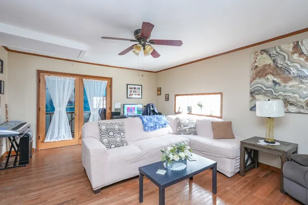 a living room with furniture and a lamp