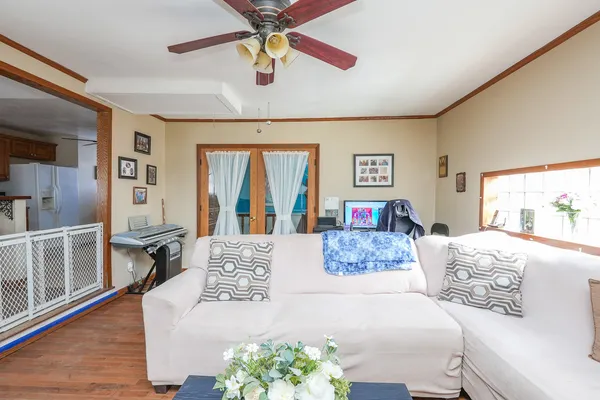 a bedroom with a large bed and a chandelier