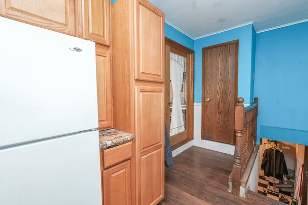 a view of walk in closet with wooden floor