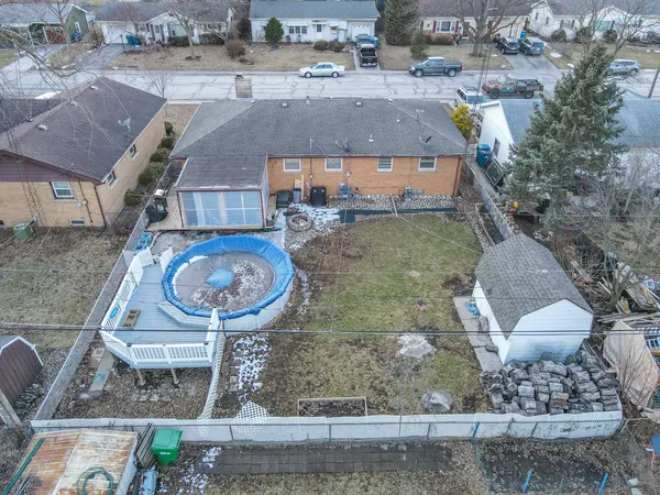 an aerial view of a house with garden space and sitting space