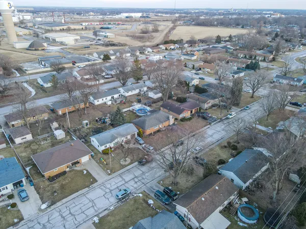 an aerial view of residential houses with outdoor space