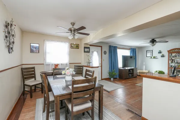 a view of a dining room with furniture and a livingroom