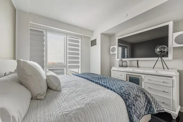 a bathroom with double vanity sink and two mirror