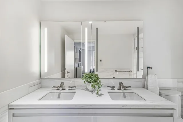 a bathroom with a shower and toilet