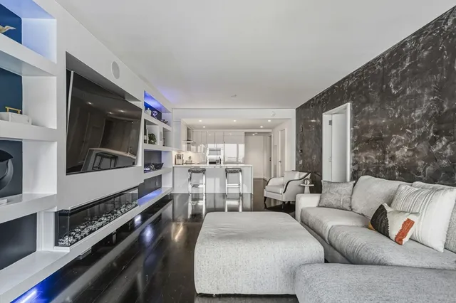 a kitchen with stainless steel appliances granite countertop a stove and cabinets