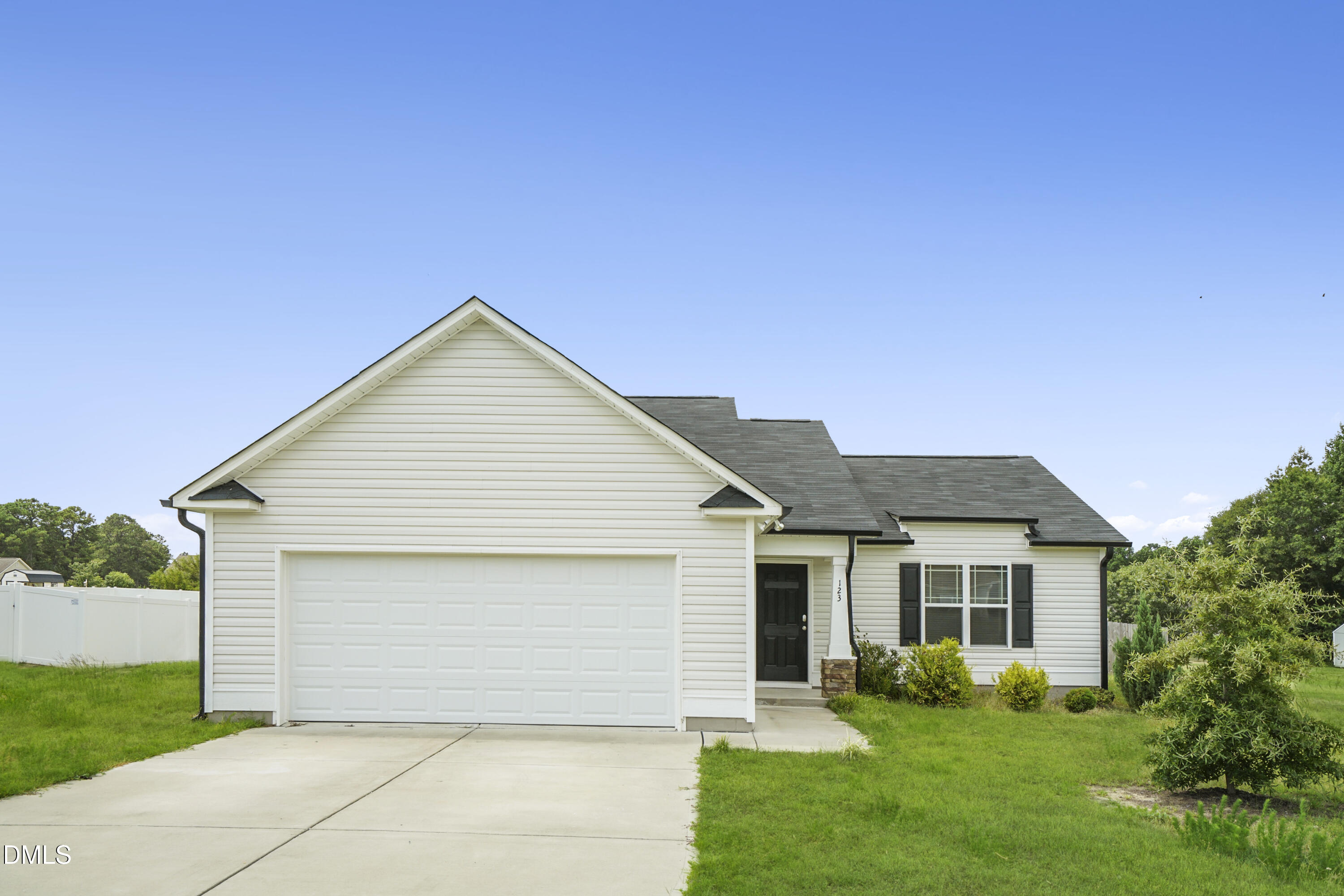 123 Willow Ridge Circle Willow Spring, NC 27592 - Photo 1 of 15 a front view of house with yard and green space