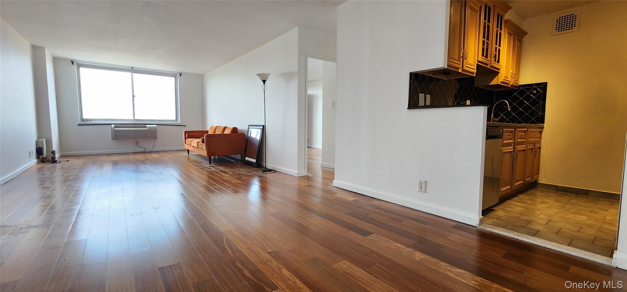 118-17 Union Turnpike, Unit 14E Queens, NY 11375 - Photo 8 of 24 a view of a living room and hardwood floor