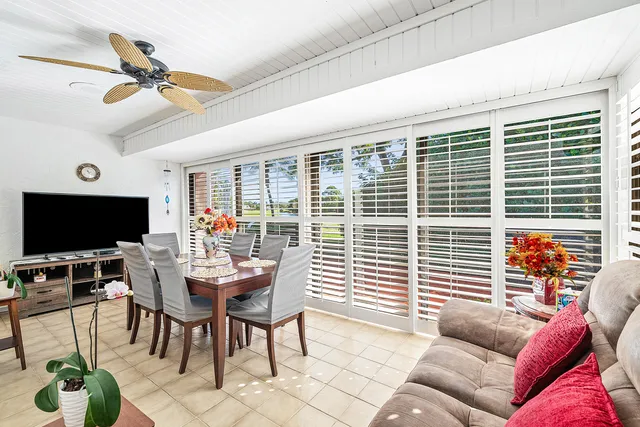 a outdoor dining space with furniture and garden view