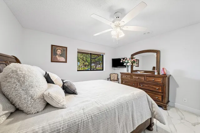 a bathroom with a sink vanity mirror and toilet