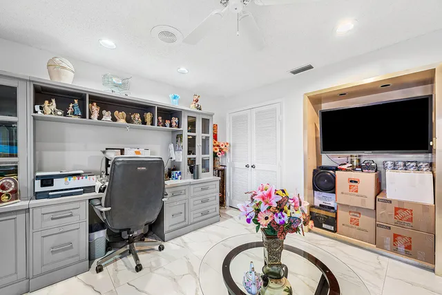 a spacious bedroom with a bed and a couch