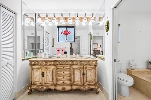 a bathroom with a sink double vanity and a mirror